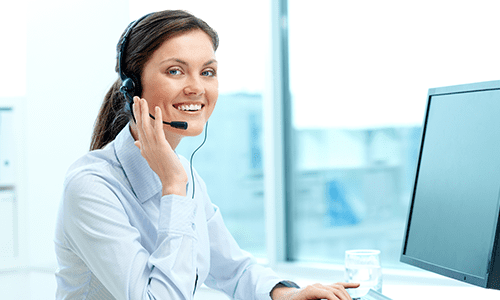 Person On Computer With Headset